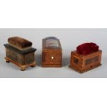 Three 19th century pincushions in box form, each with a drawer for holding threads and tools, one