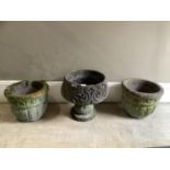 A pair of cast concrete planters and a pedestal urn with foliate scroll decoration, 40cm diameter by