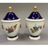 A pair of Kaiser Echtscharffeuer Kobalt Imperial vases and domed covers with petalled finial,