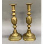 A pair of Victoria brass candlesticks on square canted bases, 29cm