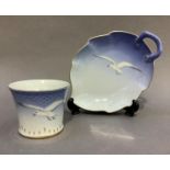 A Bing and Grondahl leaf shaped dish and vase painted with a seagull on a shaded blue ground with