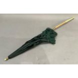 A Victorian dark green silk parasol with ivory handle set with turquoise beads