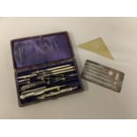 W H Harling a set of drawing instruments contained in a purple velvet and silk lined red Morocco