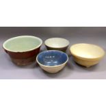 A large earthenware bowl and three mixing bowls