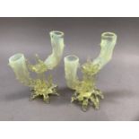 A pair of Victorian vaseline glass twin branch candle holders of naturalistic form, 15cm high