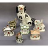Five various pottery and china cottages, a cottage moulded jug and a Staffordshire pottery spaniel