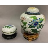 A cloisonné vase and domed cover with matching box of compressed circular form each enamelled with
