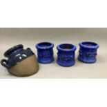 Three blue glazed cylindrical planters and a two handled together with a two handled pot modelled to