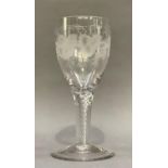 A large 18th century style goblet, the bell bowl engraved with grapes and vine leaves, on a