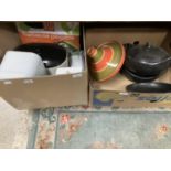 A barbecue rack, bread and other storage bins, earthenware cooking pots etc