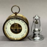 A Brevet aneroid barometer in a gilt lacquered drum case with hanging loop together with a Radcliffe