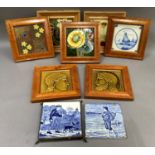 A collection of Victorian and Edwardian ceramic tiles including a pair moulded in low relief with