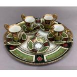 A Vienna style two handled tray and four coffee cups and saucers with one additional saucer, printed