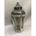 A reproduction tin and wooden tapered octagonal lantern with pierced chimney gallery and dome