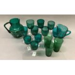 Victorian and later emerald green glass, wines and two jugs