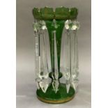 A Victorian green glass lustre detailed in gilt and hung with clear glass prismatic drops, 27cm high