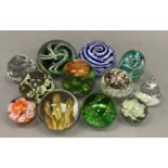A collection of glass paperweights of various designs