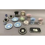 A collection of Wedgwood jasper ware in mauve, blue, pale green and black including clock, vases,