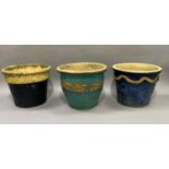 Three various pottery planters approximately 37cm high by 30cm wide