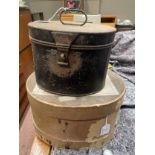 A black enamelled metal wig tin together with a vintage cardboard hat box