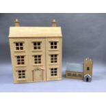A doll's house with double opening front complete with furniture in plywood together with a