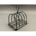 A Victorian silver five bar toast rack with loop handle and on ball feet, approximate weight 3oz