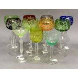 Eight harlequin glass hocks and three other long stemmed wine glasses