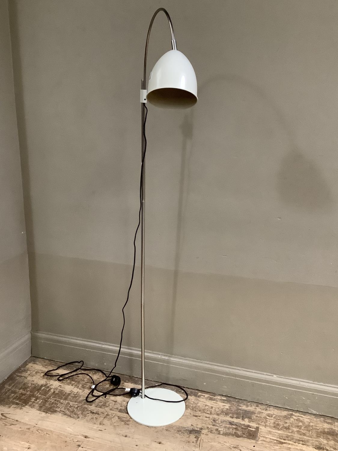 A modern grey painted and white metal standard reading lamp with arched arm, cowl shade and circular