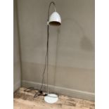A modern grey painted and white metal standard reading lamp with arched arm, cowl shade and circular