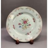 An 18th century Chinese famille rose plate painted with ribbon-tied peony and other flowers to the