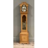 An oak cased grandmother clock by Townsend of Follifoot 1985, having an arched hood with acorn