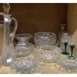 A cut glass claret jug with facetted stopper, a cut glass pedestal fruit bowl, stand, decanters