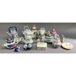 A collection of miniature teapots, Arcadian china crested vase, together with a book on teapots