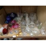 A collection of clear and coloured glass including vases, bowls, candle stands, scent bottles etc