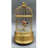 A Swiss automaton in the form of a bird in a gilded cage by Reuge Music, 28.5cm high