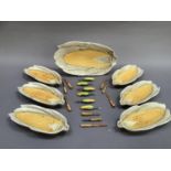 A seven piece set for corn on the cob including a large serving dish and six individual dishes,