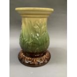 A Leeds Art Pottery majolica jardinière stand glazed in butter yellow, green and brown, impress mark