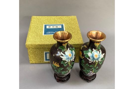 A pair of 20th century Chinese cloisonné, vases of shouldered ovoid outline, enamelled with peony in - Image 1 of 4