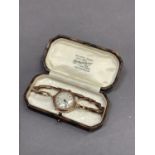 A George V lady's wristwatch by Filson in 9ct rose gold cushion case no. 635366, Swiss 17 jewelled