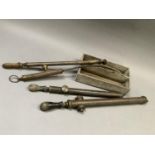 Four vintage brass garden spray hoses together with a two division wooden cutlery box