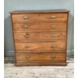 An Edwardian walnut chest of five graduated drawers, brass swing handles and on plinth base, 128cm