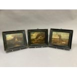 A set of three hunting scenes, over painted prints in ebonized frames, each 21cm by 24cm including
