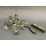 Two silver lidded glass toilet jars and six silver lidded/collared bottles, 14cm high max,