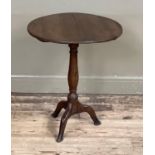 An oak circular tilt top table on vase column and tripod base (alterations and cut down)