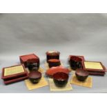 A quantity of Japanese lacquer style rice bowls and platters