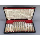 A set of six horn handled steak knives and forks with Sheffield steel blades by Humphries and