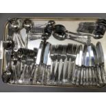 A set of King's pattern stainless steel cutlery comprising twelve dinner knives and forks, twelve