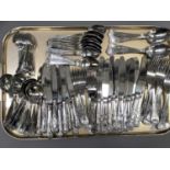 A suite of King's pattern stainless steel cutlery comprising twelve dinner forks and knives,