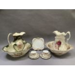 Two early 20th century toilet jugs and bowls and items of floral and gilt tea ware