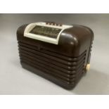A Bush radio AC/DC receiver type DAC10 in brown and cream Bakolite case with louvered section,